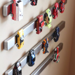 park toy cars on a magnetic knife rack tripe